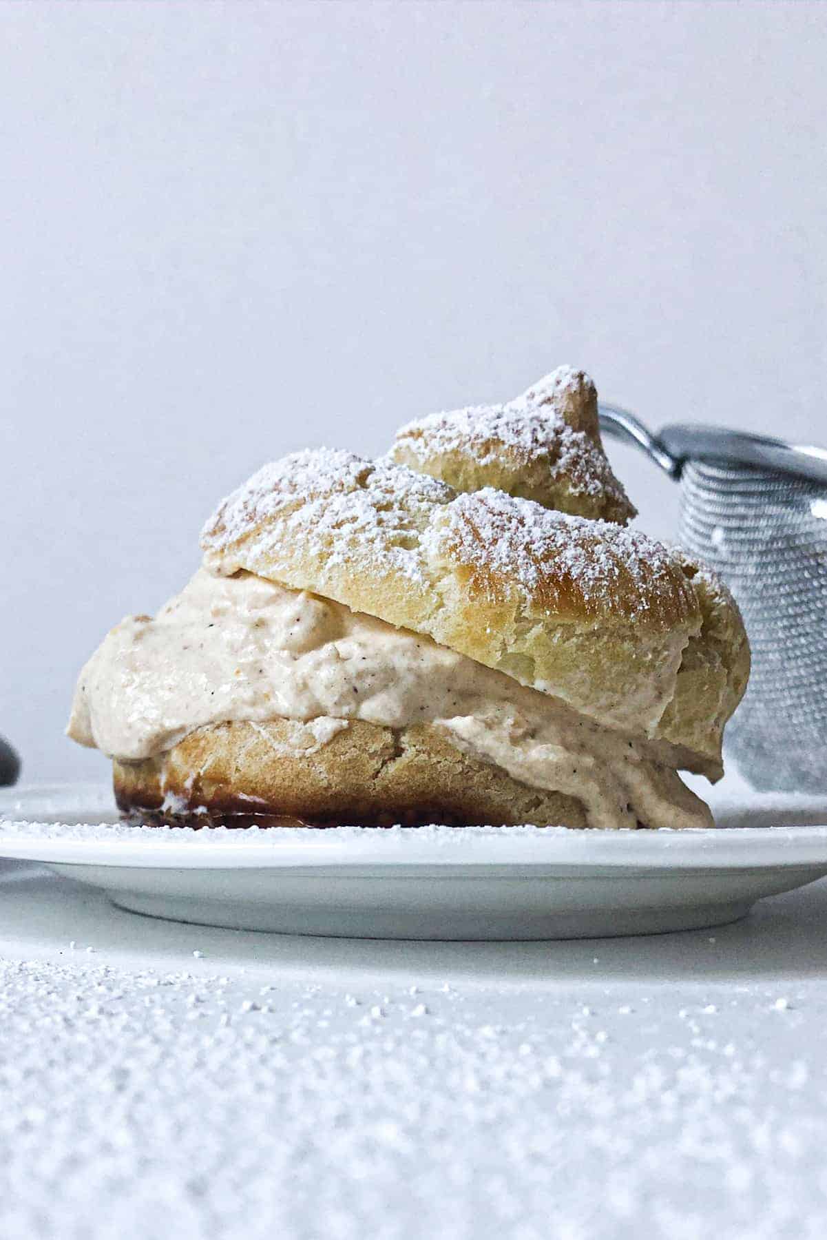 Pumpkin spice cream puff from the side.