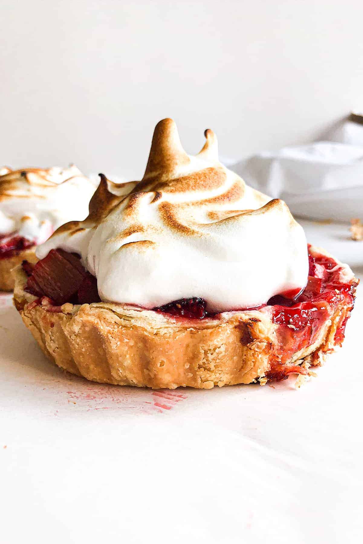 strawberry rhubarb tartlet with italian meringue from the side