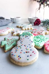 Snowman sugar cookie with sprinkles.