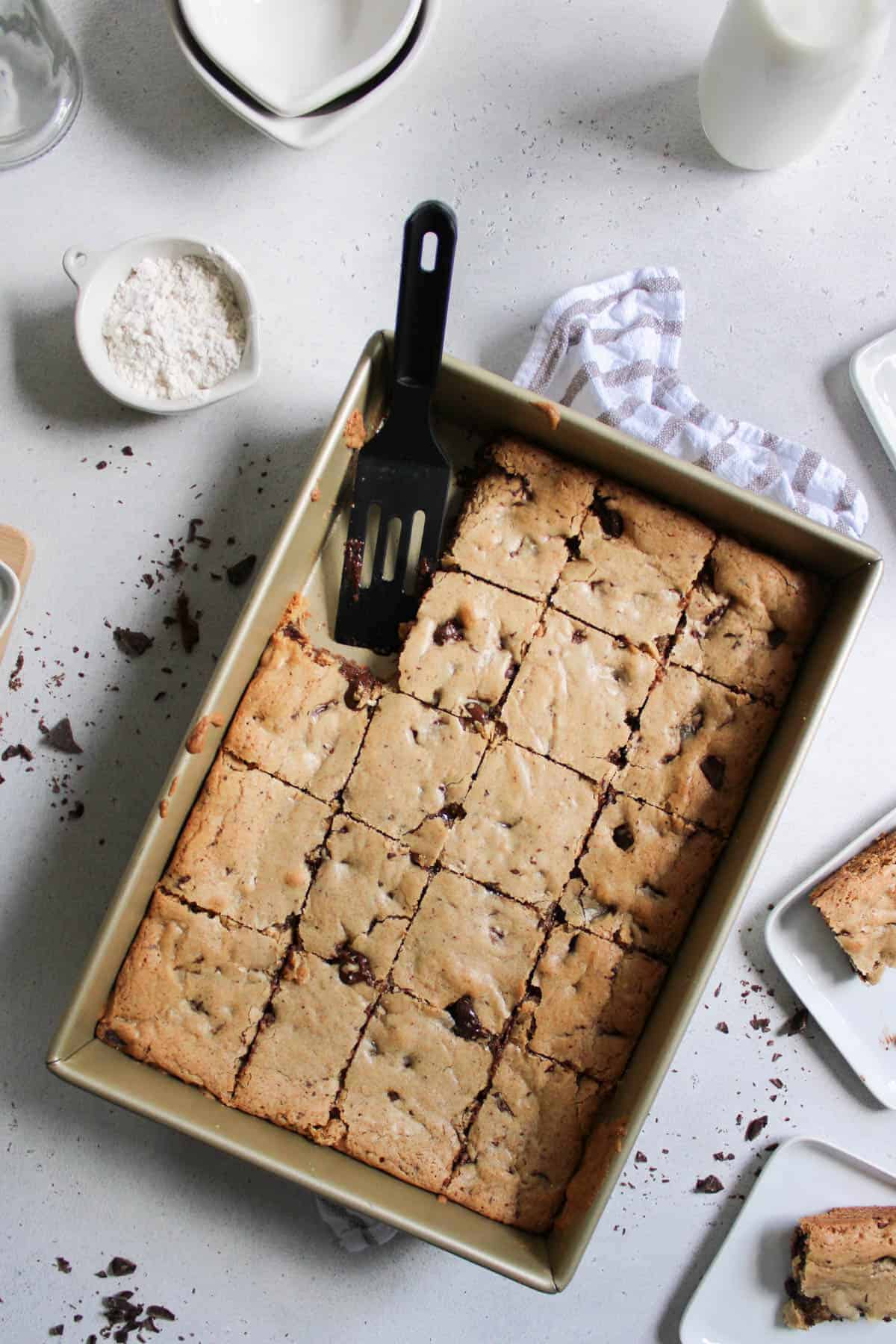 Lazy chocolate chip cookie bars cut in the pan.
