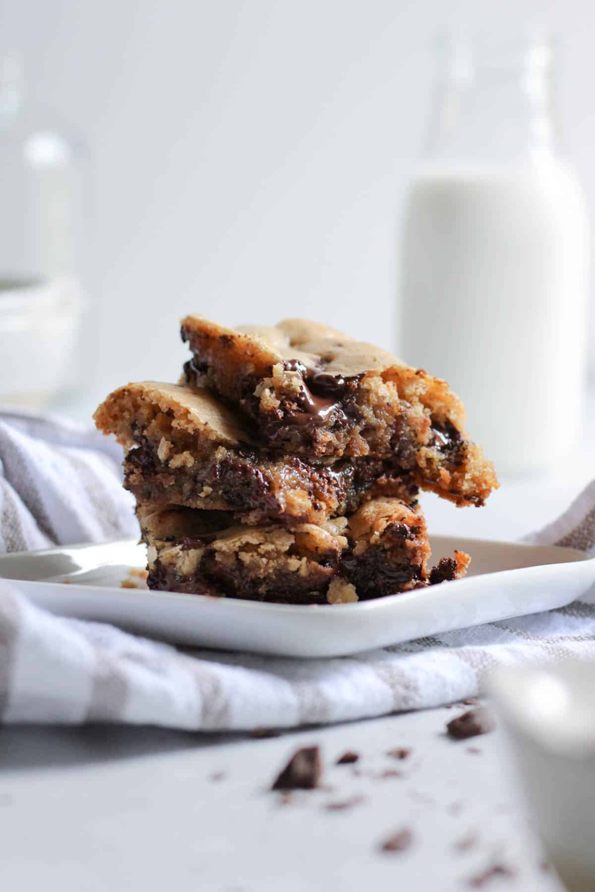 Brown butter chocolate chip cookies stacked on top of each other. 