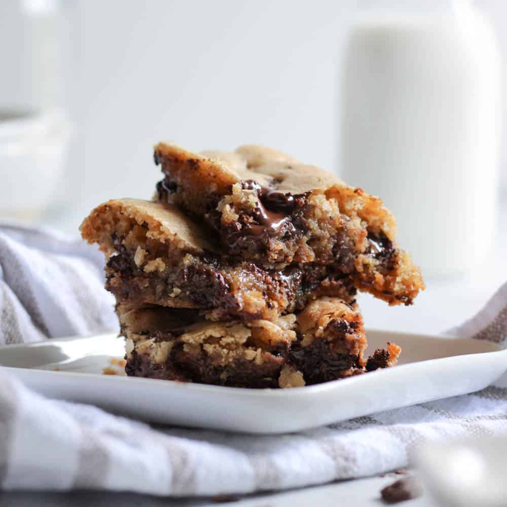 Chocolate chip cookie bars stacked on top of each other.