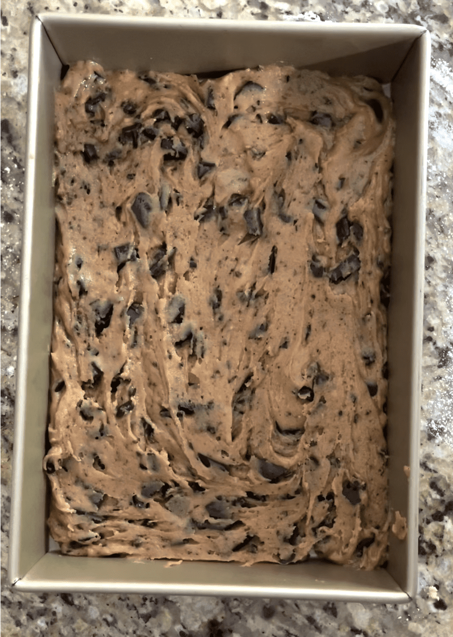 Cookie bar batter spread into 9x13 pan.