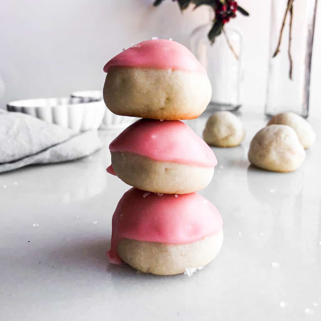 maraschino cherry cookies stacked on top of each other