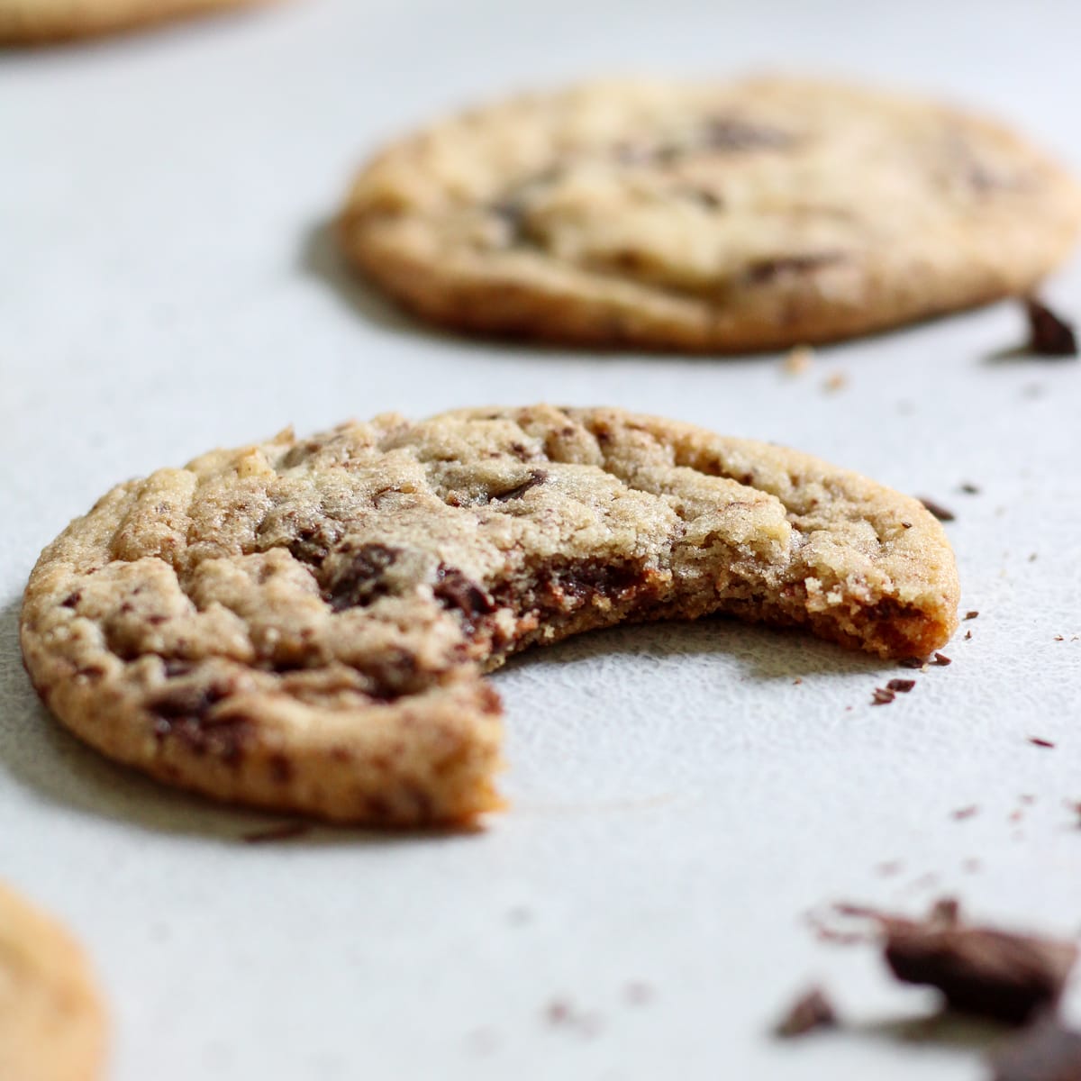 Sweet and salty chocolate chip cookie with a bite out.